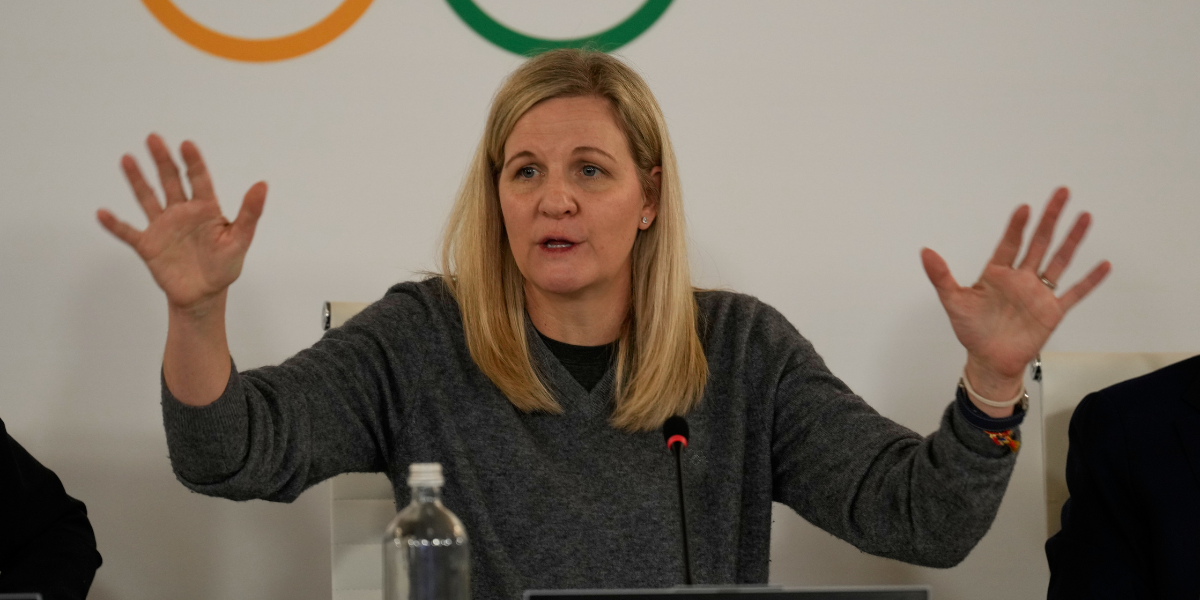 the president of the IOC at a press conference