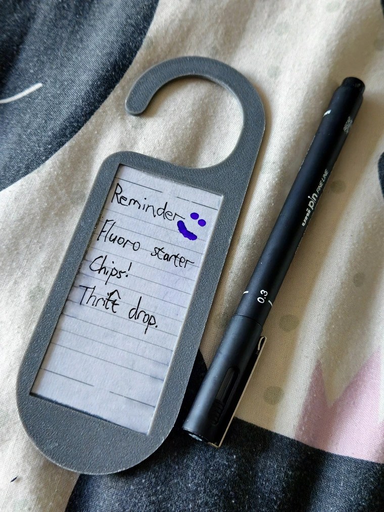 I made an erasable door sign for reminders that can leave the house with me when necessary.