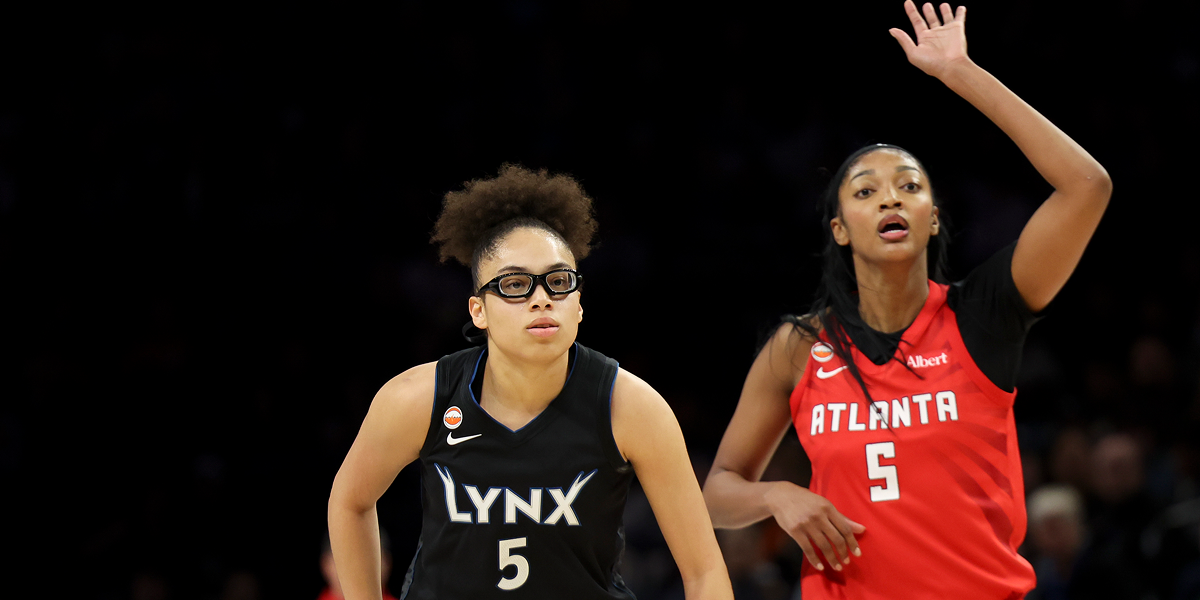 MINNEAPOLIS, MINNESOTA - MAY 09: Olivia Miles #5 of the Minnesota Lynx and Angel Reese #5 of the Atlanta Dream look up the court during the third quarter at Target Center on May 09, 2026 in Minneapolis, Minnesota.