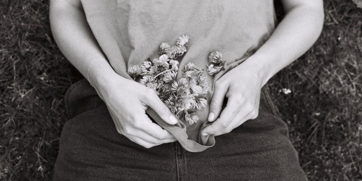 a person holding a bunch of flowers
