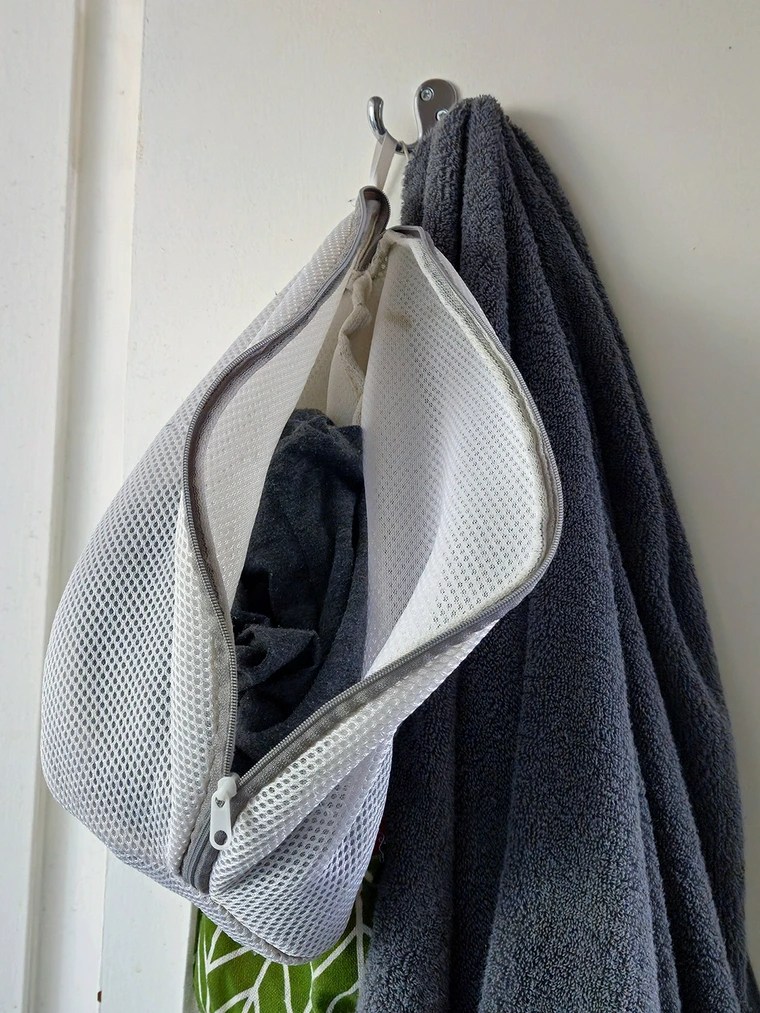 I hang delicates bags around the house and deposit washing throughout the week. I gather the bags in a single trip on laundry day and drop them in the washer.