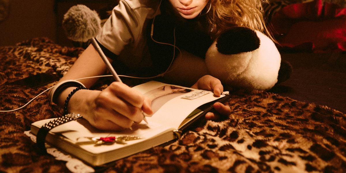 someone writing in their journal