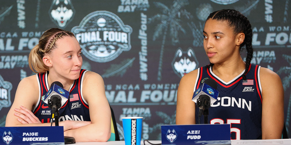 Paige and Azzi at a press conference