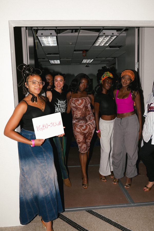 A group of models backstage, selected by designer Moses Aina for her label IGBO-SISUN.