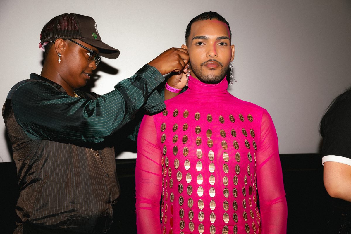 Chris Rodriguez getting styled in Atashi RTW.