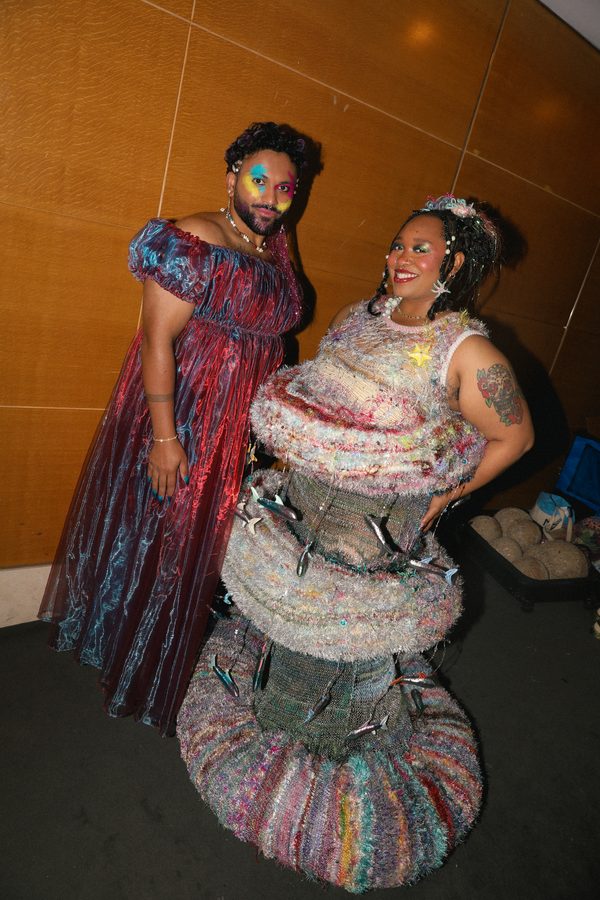 Two models in a splash of color get ready to hit the runway for Jasmine Knits.