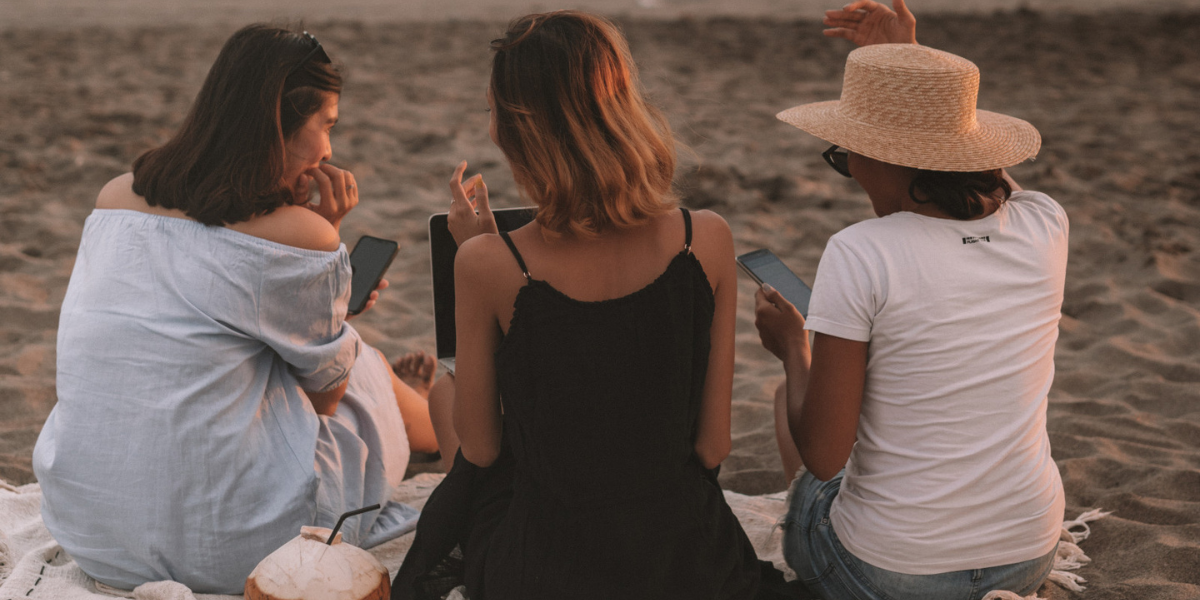 three women at a beach